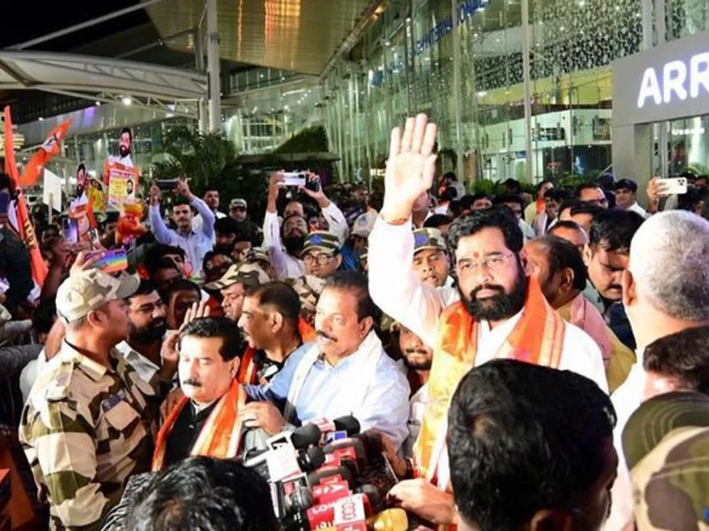 Maharashtra Chief Minister Eknath Shinde is visiting Uttar Pradesh's Ayodhya temple with Shiv Sena MPs and MLAs. This move aims to gain control of Shiv Sena founder Balasaheb's political legacy from the Uddhav Thackeray faction. Shinde's first visit to Ayodhya after becoming Maharashtra chief minister in June 2022, recognises his organisation as Shiv Sena with the "bow and arrow" electoral insignia on it. The Shiv Sena has reserved all the hotels, guest houses, and dharamshalas to host Shiv Sena ministers, MPs, and MLAs.