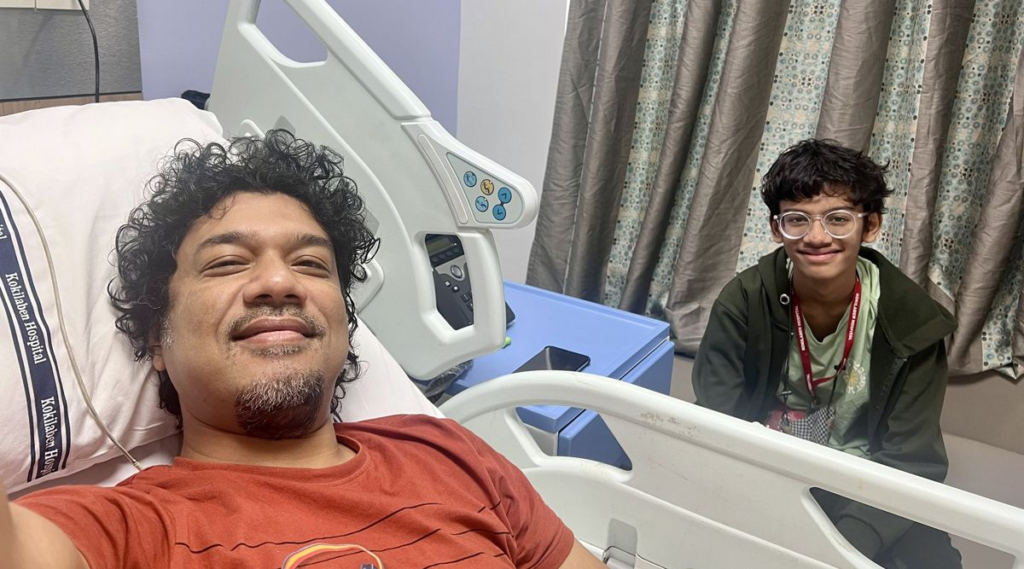 Popular singer Papon has recently been admitted to the Kokilaben Dhirubhai Ambani Hospital in Mumbai due to some health issues. He shared the news on his Instagram handle by adding a picture with his 13-year-old son, who can be seen sitting on a chair beside him.