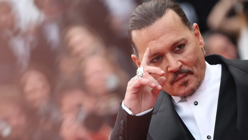 Johnny Depp's film 'Jeanne Du Barry' opened the 76th Cannes Film Festival with a remarkable seven-minute standing ovation. The actor, who plays King Louis XV in the movie, was visibly emotional as the crowd erupted in applause. This marks Depp's acting comeback after a three-year hiatus and a legal battle with ex-wife Amber Heard. Read on to watch the touching moment and learn more about the film's premiere at Cannes.