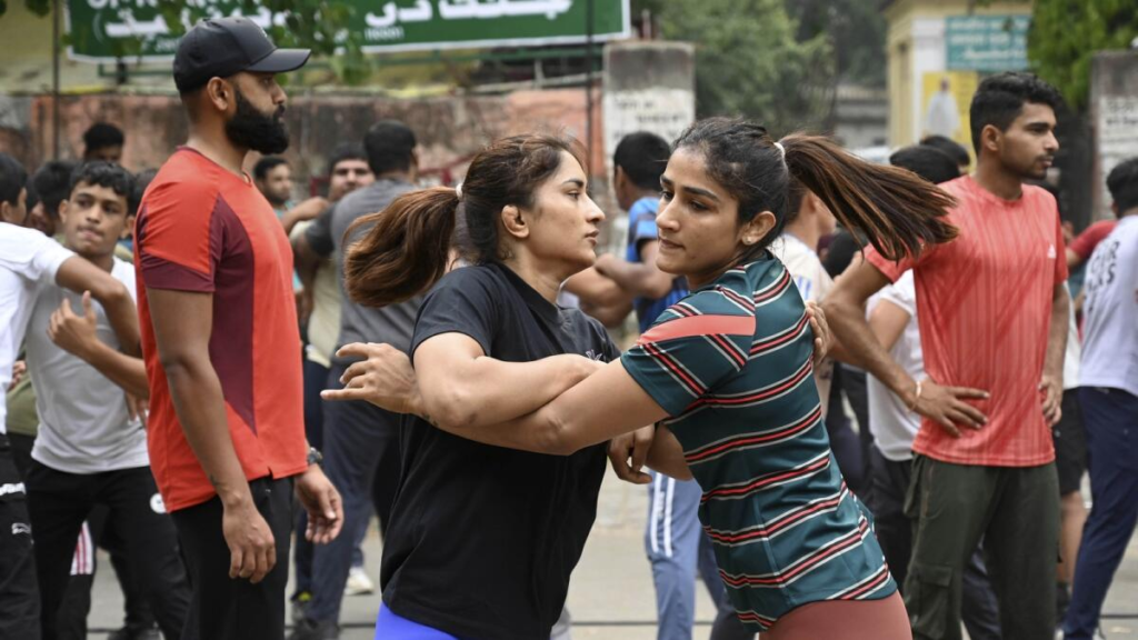 Wrestlers protesting against the Wrestling Federation of India at Jantar Mantar in Delhi have threatened to return their medals after alleging harassment by the police. Vinesh Phogat and Bajrang Punia said they are being humiliated and abused by the police, and the Delhi Police has ramped up security deployment at the protest site