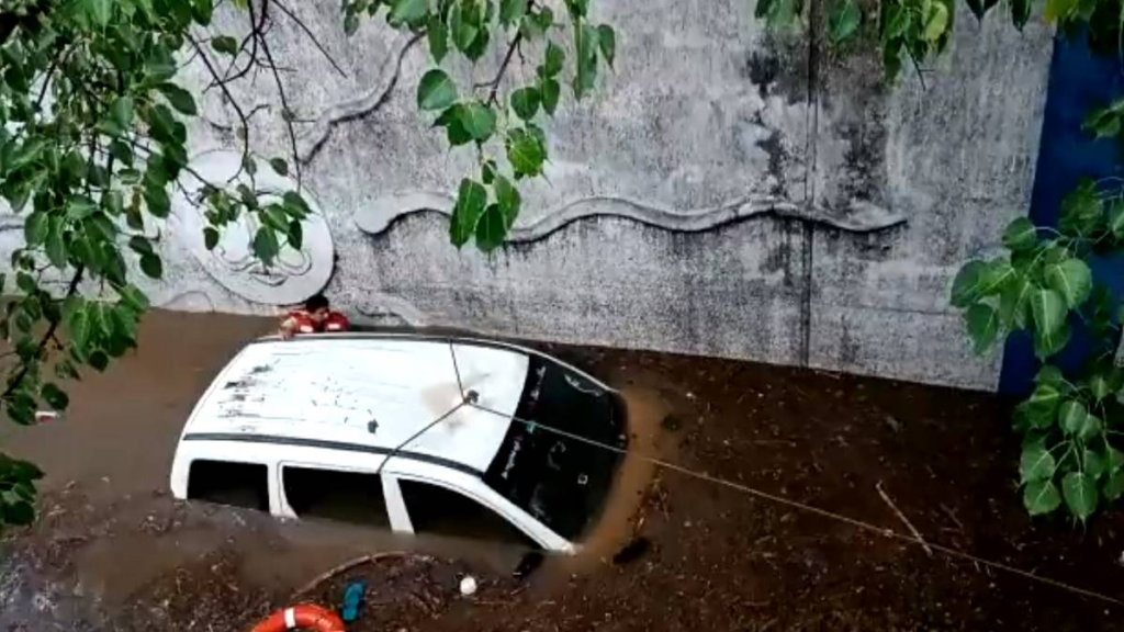  In a tragic incident, a woman met with a fatal end as her car got submerged in a flooded underpass in Bengaluru.