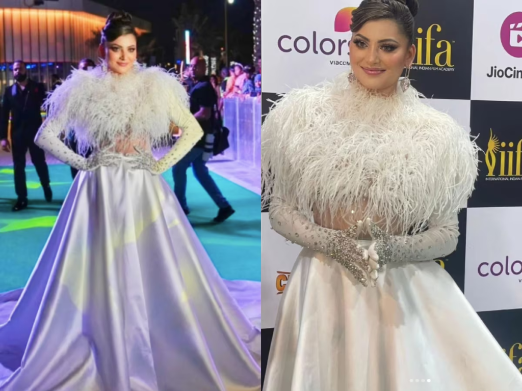 Urvashi Rautela captivates the audience at IIFA 2023 with her mesmerizing entry in an all-white feather gown by Atelier Zuhra. Her impeccable style and ethereal charm leave everyone in awe, solidifying her status as one of Bollywood's enchanting actresses.

