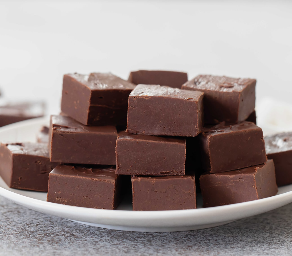 Discover the origins of fudge and how it came to be. Celebrate National Fudge Day 2023 by exploring delightful fudge recipes and learning about this delicious treat. Indulge in the smooth texture and rich flavors of fudge and satisfy your sweet tooth.

