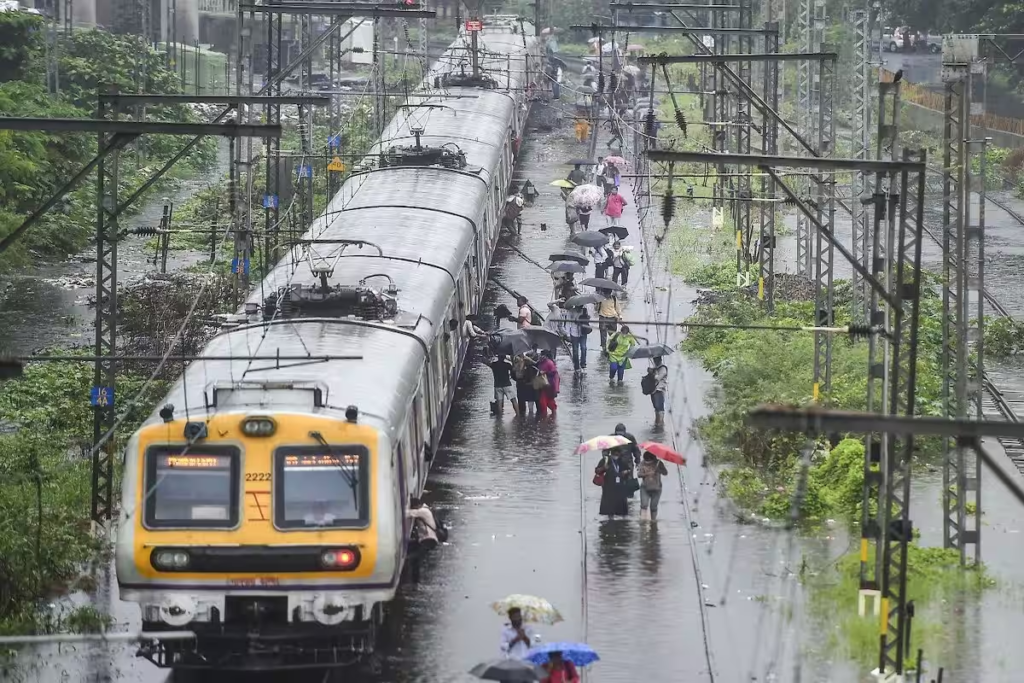 Heavy rainfall in Mumbai has resulted in the flooding of railway tracks, leading to the temporary suspension of local train services between Badlapur and Ambernath. The situation has caused significant disruptions in the region. Stay informed about the latest developments regarding the impacted train services.

