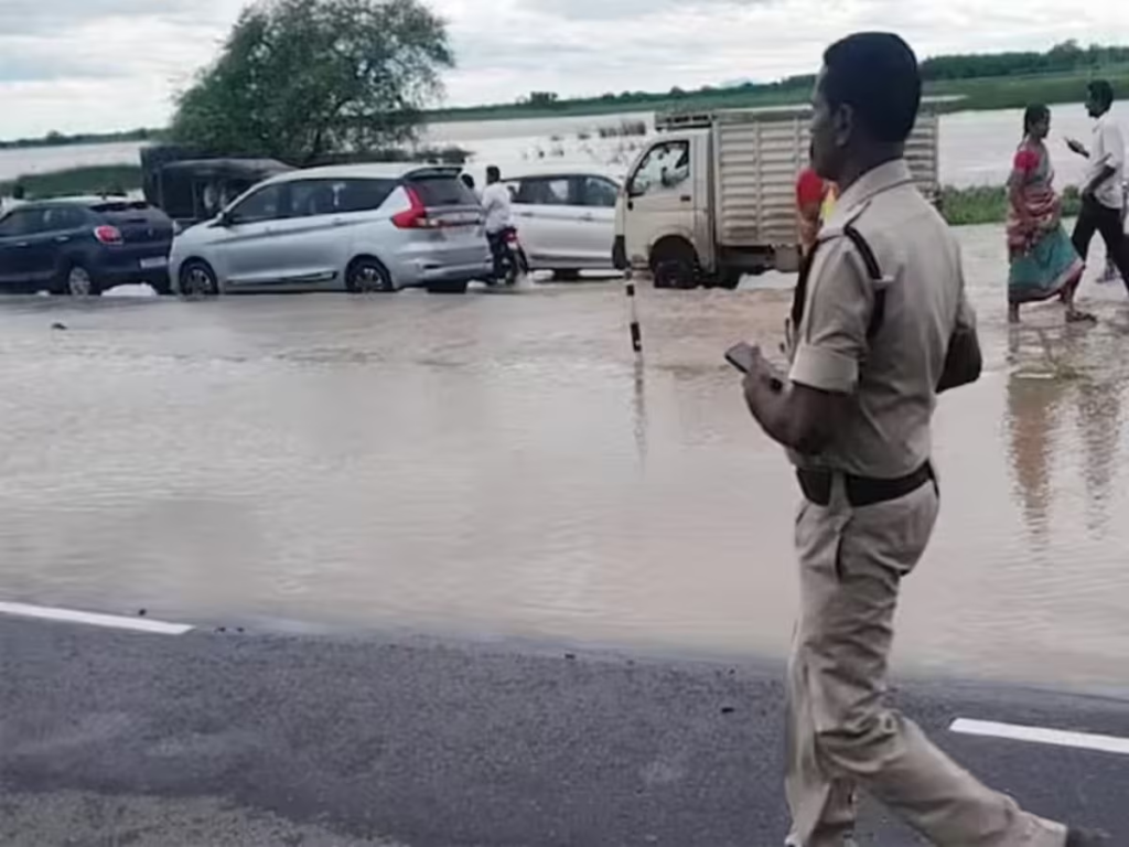 Traffic between Hyderabad and Vijayawada was suspended on Friday due to flooding on National Highway 65. The Munneru River overflowed, inundating the highway and causing a massive traffic jam. TSRTC buses were diverted to an alternate route.