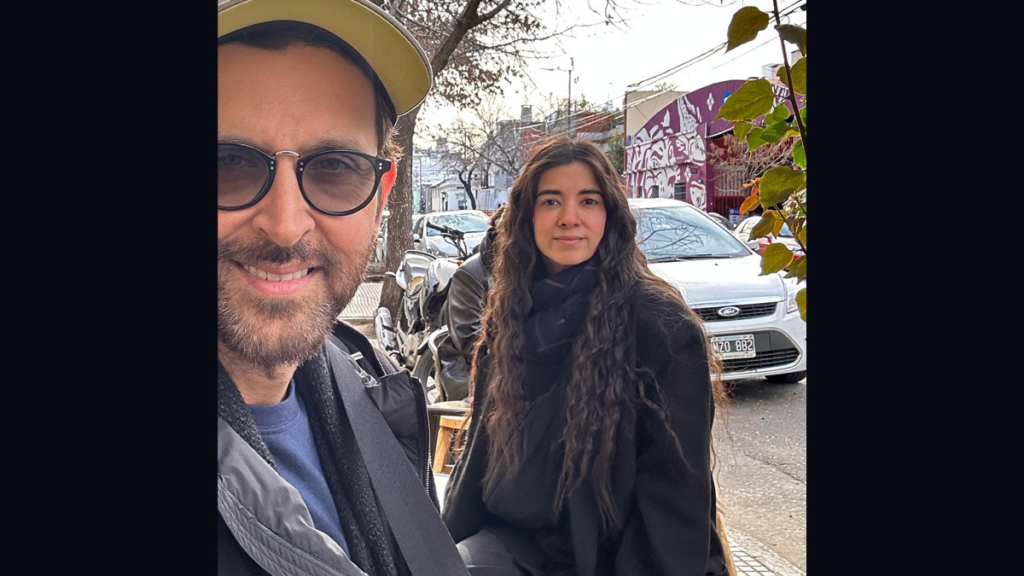  Bollywood stars Hrithik Roshan and Saba Azad are currently on vacation in Buenos Aires, Argentina. They have been sharing pictures of their trip on social media, and Hrithik recently posted a selfie with Saba, calling her his "winter girl." The two are seen posing in front of a cityscape, with Hrithik wearing a blue T-shirt and black jacket, and Saba wearing a black overcoat. The photo has been liked by over 1 million people on Instagram.