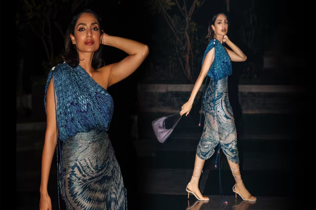 Sobhita Dhulipala turned heads in a strapless black bodycon dress layered with a bold blue shirt at a promotional event for 'Made In Heaven 2.' The stunning outfit from Reik Studio was complemented by her choice of accessories, including a choker necklace and black Christian Louboutin heels. Her purple winged eyeliner and nude lip gloss added a touch of glamour. Check out the pics of her fashion-forward look!