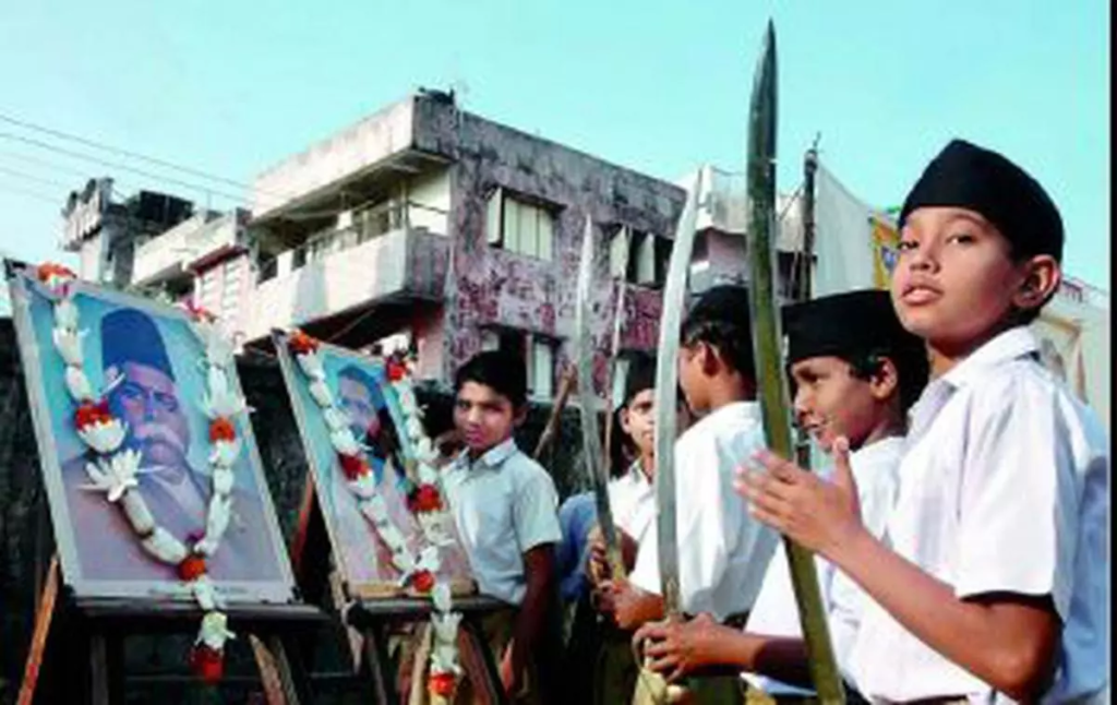 "The Department of Personnel and Training (DoPT) has lifted the ban on government employees participating in RSS activities. The decision has sparked a political divide, with the Congress expressing concerns over the secular nature of the state, while the BJP has supported the move as a step towards justice. The development highlights the ongoing tensions and the influence of political affiliation on government policies."






